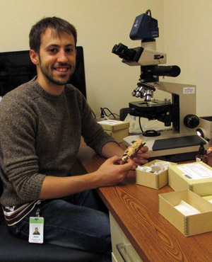 Javier Fernández López Man using microscope.