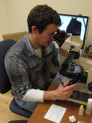 Rocky Houghtby Man using microscope.
